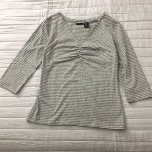 Grey/white striped 3 quarter sleeve shirt.